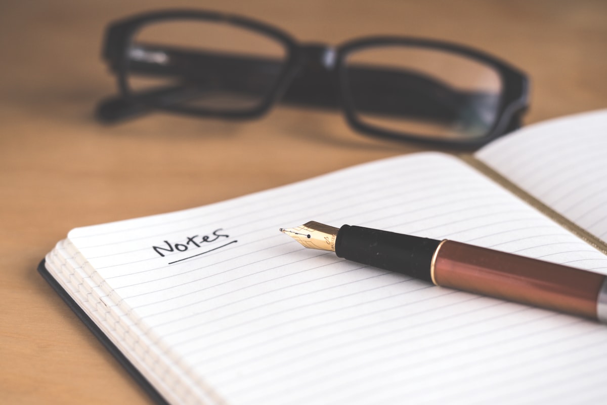 Notebook and pen on a desk ready for weekly planning